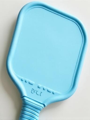 The Breeze Ball Zephyr pickleball paddle with a light blue and white design.